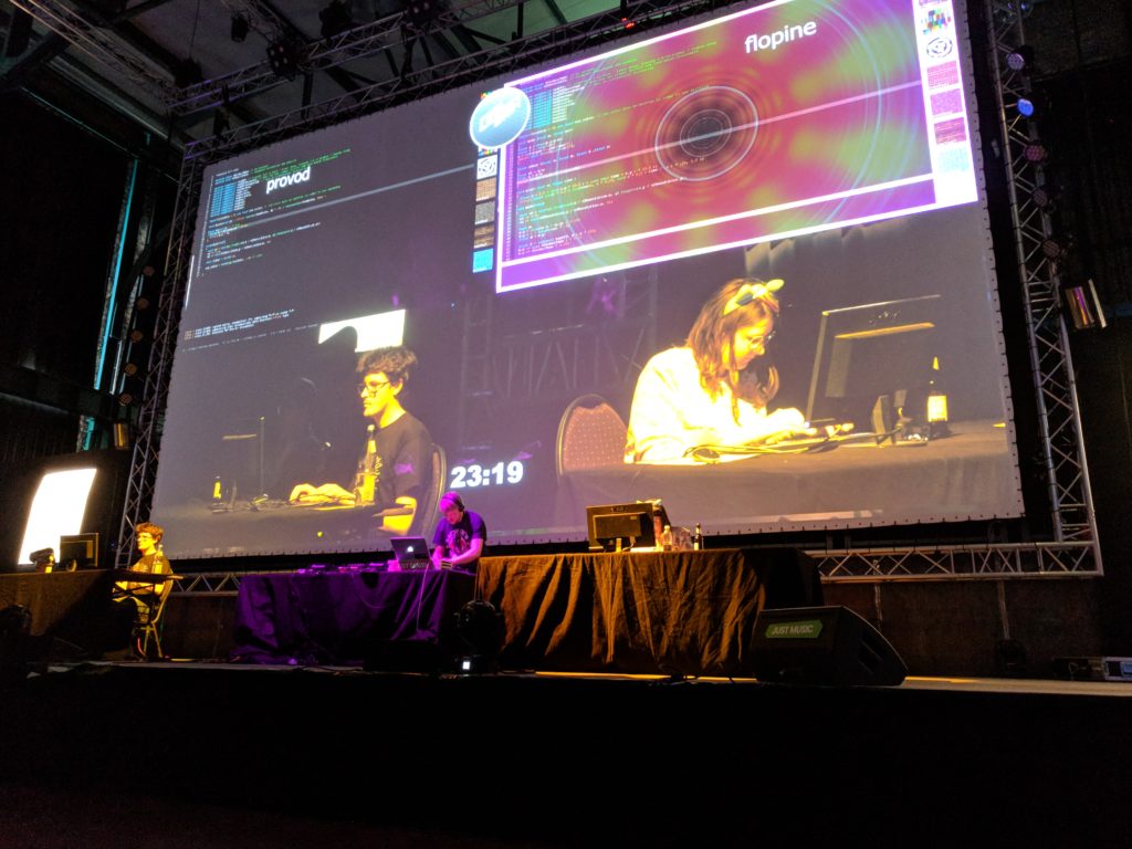 Photo of the Revision 2018 final match: provod vs Flopine, with Ronny mixing.